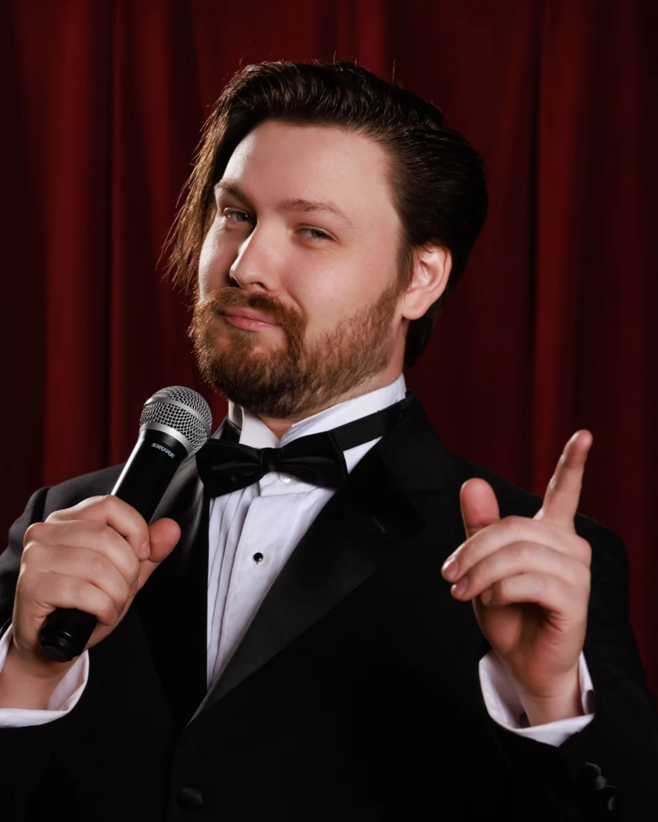Cabaret emcee holding a microphone