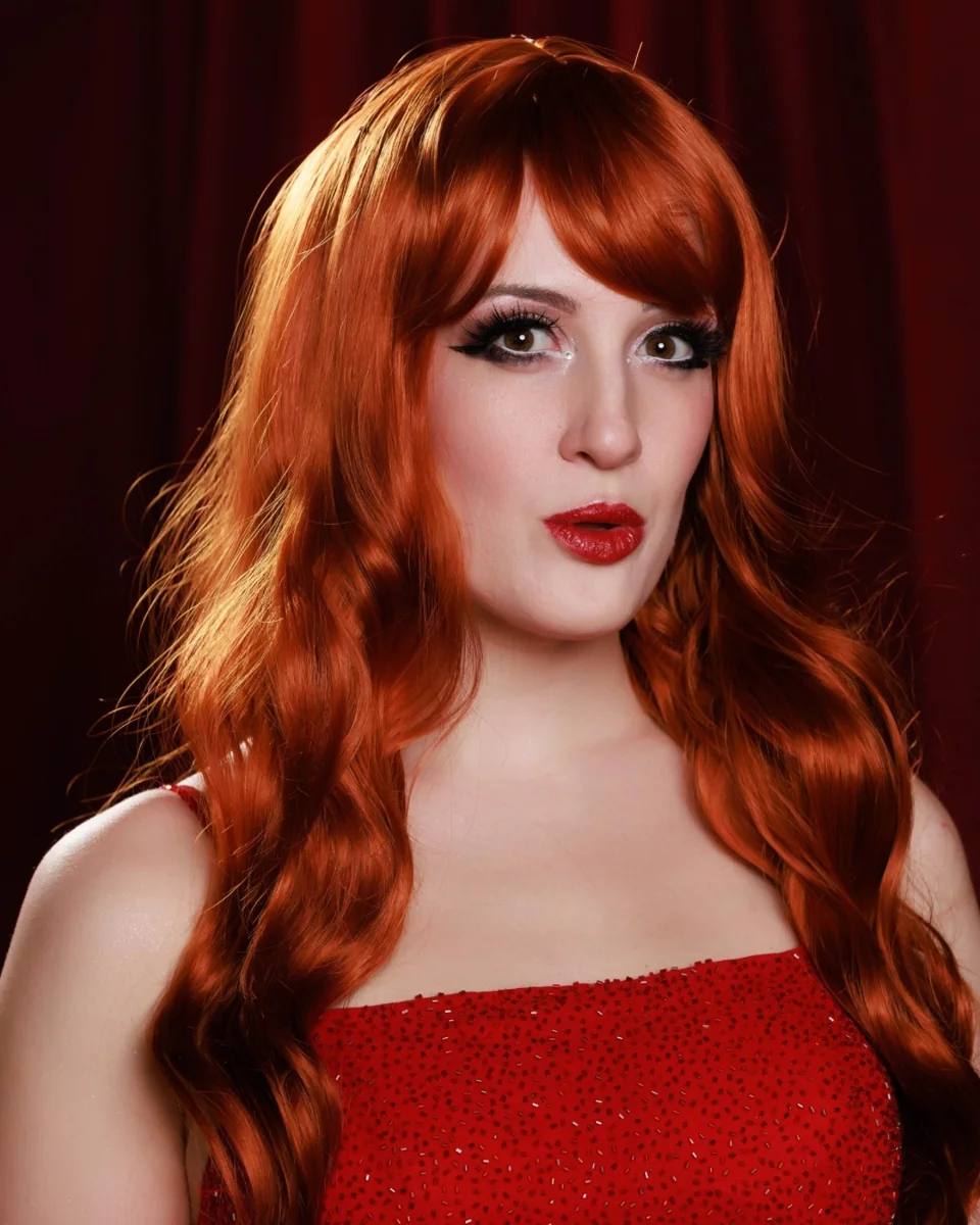 Close-up portrait of a glamorous redheaded cabaret performer